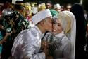 Hundreds of Indonesian couples ring in the new year at mass wedding